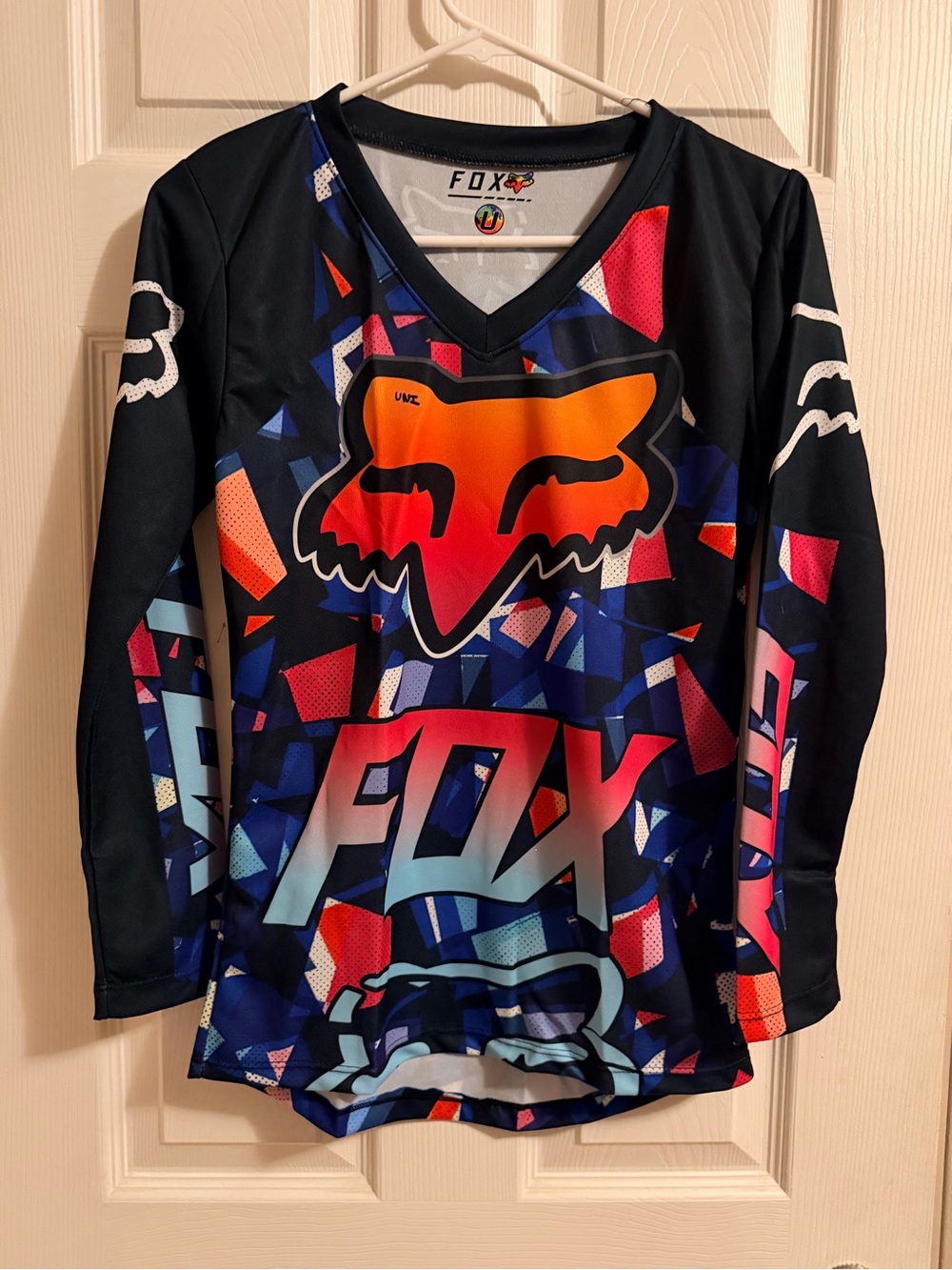 Fox women’s Long Sleeve Graphic Jersey - Black with Orange & Blue Accents